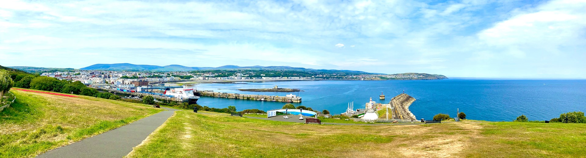 A view of a bay on the Isle Of Man on a sunny day.