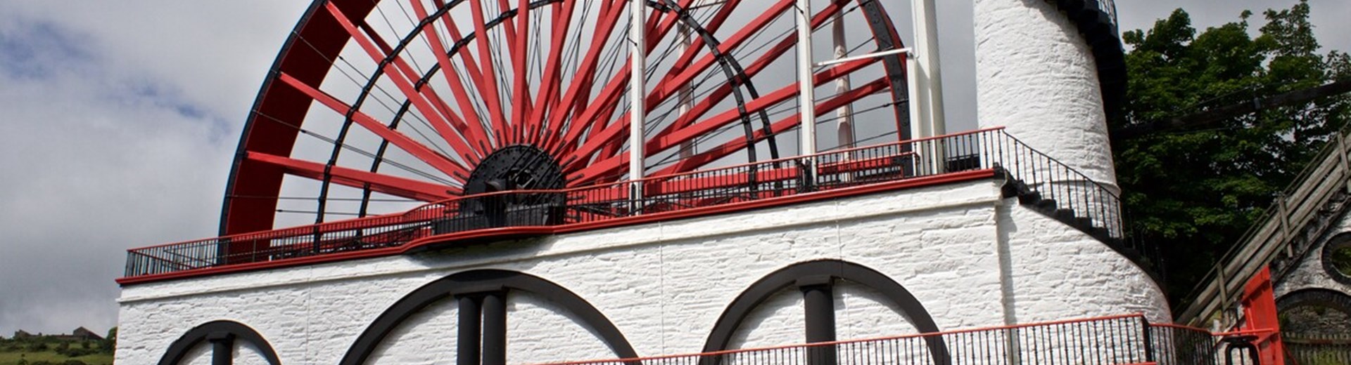 Laxey Wheel Isle Of Man. A large red and white waterwheel used to pump water. 