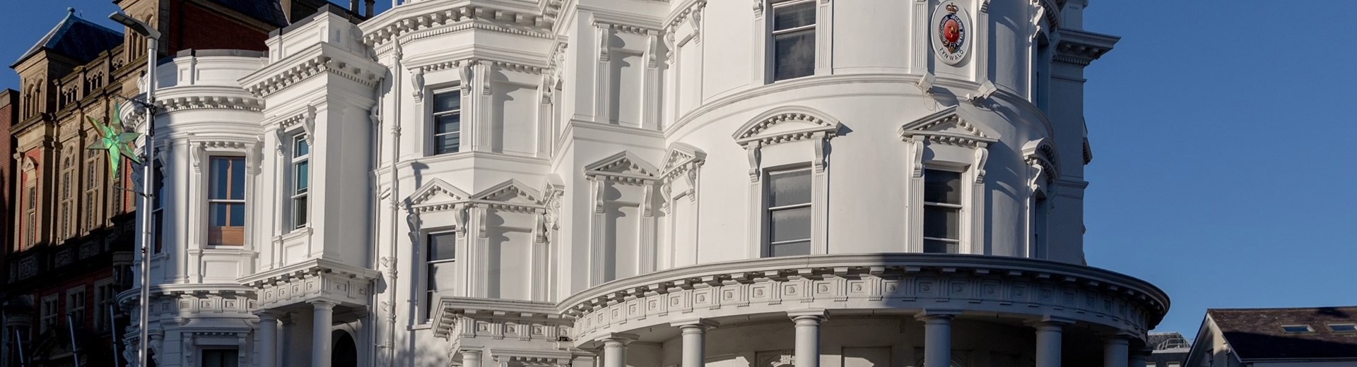 Isle Of Man Tynwald Legislative Buildings. The Building is large, round and white and is often nicknamed 'wedding cake' as it resembles one architecturally.  